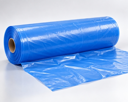Wide blue LDPE Barsati Sheet roll with smooth plastic sheeting partly unrolled